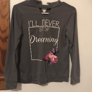 A kids grey long sleeve shirt with a quote